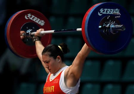 Silver medal winner Cao Lei of China competes in the women's 75 kg weightlifing competition at the 16th Asian Games in Guangzhou, Guangdong province November 18, 2010. REUTERS/Mick Tsikas