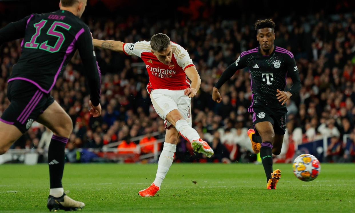 <span>Leandro Trossard sweeps his equaliser past Manuel Neuer (out of picture) to make it 2-2 against Bayern Munich.</span><span>Photograph: Tom Jenkins/The Guardian</span>