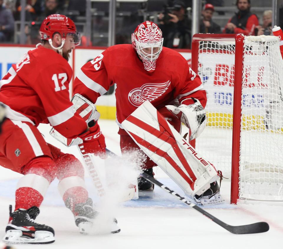 Red Wings defenseman Filip Hronek and goaltender Ville Husso defend against the Ducks during the second period of the Wings' 5-1 win over the Ducks on Sunday, Oct. 23, 2022, at Little Caesars Arena.
