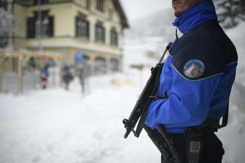 Security: A police officer at Davos for the start of the World Economic Forum (EPA)