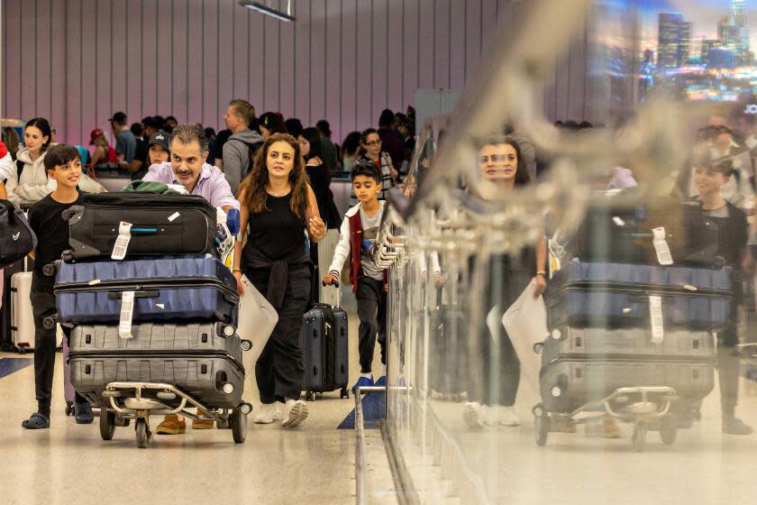 Los Angeles, CA - July 07: A large number of travelers make their way through Tom Bradley International Terminal at LAX, as a record amount of passengers pass through the airport today wrapping up a busy July 4th holiday on Sunday, July 7, 2024 in Los Angeles, CA. (Jason Armond / Los Angeles Times)