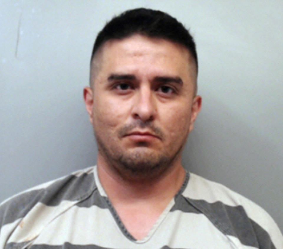 FILE - This file photo provided by the Webb County Sheriff's Office shows U.S. Border Patrol agent Juan David Ortiz. An attorney representing Ortiz, who is accused of killing four women in Texas is asking a judge to reduce his client's bond, claiming that conditions in jail amount to cruel and unusual punishment. An affidavit filed late last week says Ortiz has been denied clothing, eyeglasses and a toothbrush in his cell at the Webb County Jail in Laredo, where he has been held on $2.5 million bond since his arrest on Sept. 16, 2018. (Webb County Sheriff's Office via AP, File)