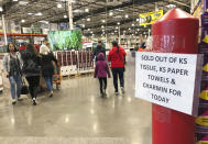 Shoppers visit a Costco Wholesale in Tigard, Ore., Saturday, Feb. 29, 2020, after reports of Oregon's first case of coronavirus was announced in the nearby Oregon city of Lake Oswego on Friday. (AP Photo/Gillian Flaccus)