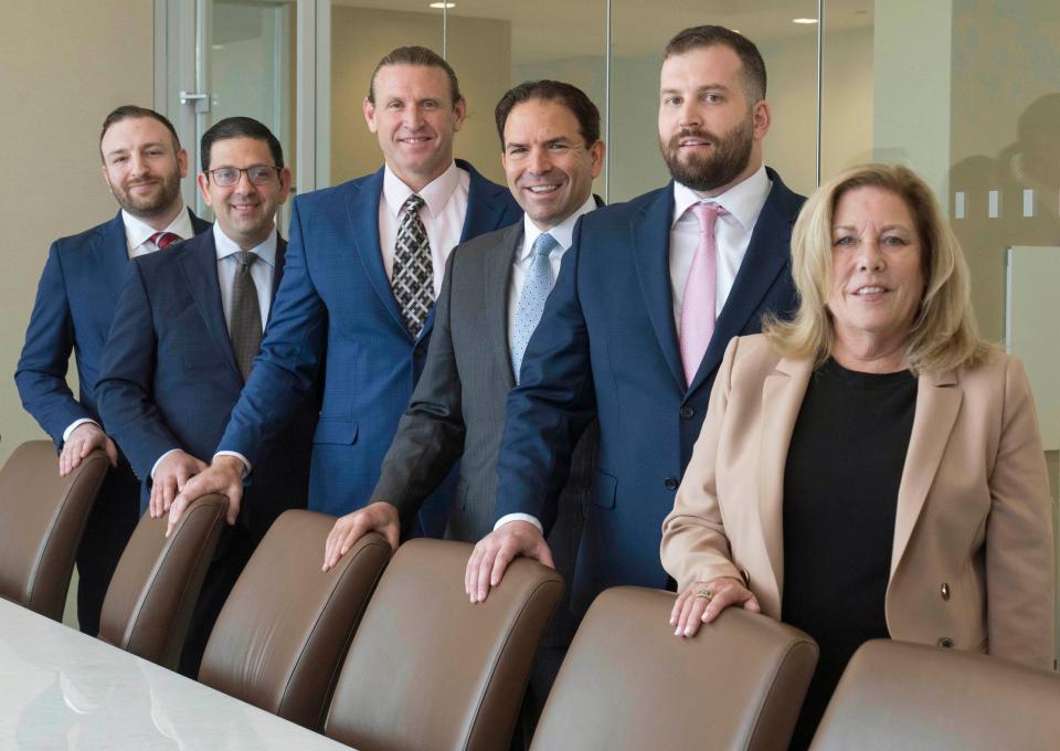 Holland & Knight attorneys Alex Englander, left, Seth Welner, Joseph Grant, Matthew Zimmerman, Jeffrey Schacknow and paralegal Diane Nixon at the law offices in West Palm Beach, Florida on November 2, 2023.