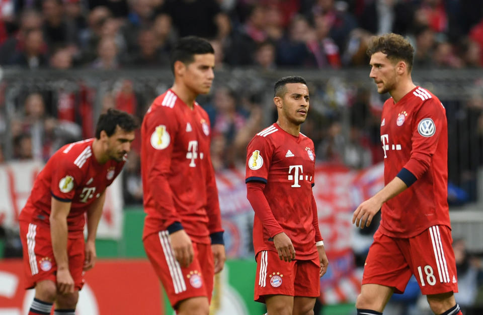 Soccer Football - DFB Cup - Quarter Final - Bayern Munich v Heidenheim - Allianz Arena, Munich, Germany - April 3, 2019  Bayern Munich's Mats Hummels, James Rodriguez, Thiago and Leon Goretzka react after conceding their second goal scored by Heidenheim's Marc Schnatterer               REUTERS/Andreas Gebert  DFB regulations prohibit any use of photographs as image sequences and/or quasi-video