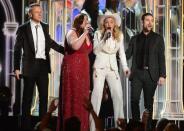 Macklemore (L), Ryan Lewis (2ndR), Mary Lambert (2ndL), Madonna (C) perform the song "Same Love" during the 56th Grammy Awards at the Staples Center in Los Angeles, California, January 26, 2014