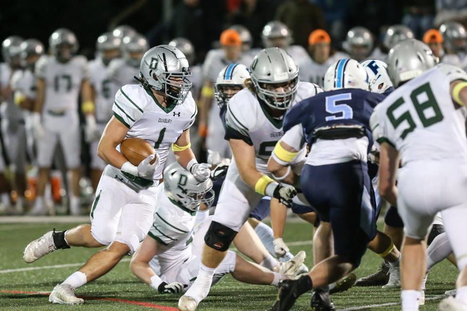 Duxbury junior Alexander Barlow looks for an opening in the defense during the football game against Franklin at Franklin High School on Sep. 23, 2022.