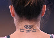 <p>Tokyo 2020 Olympics - Gymnastics Artistic Training - Ariake Gymnastics Centre, Tokyo, Japan - July 22, 2021 A Olympic rings tattoo is seen on the neck of Vanessa Ferrari of Italy during training REUTERS/Dylan Martinez</p> 