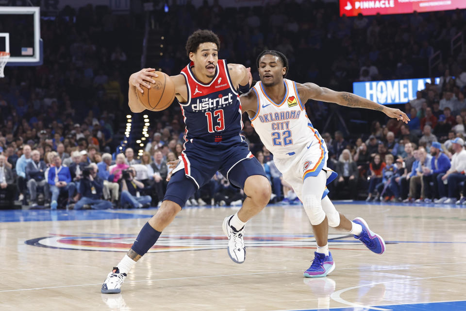 Feb 23, 2024; Oklahoma City, Oklahoma, USA; Washington Wizards guard Jordan Poole (13) moves the ball around Oklahoma City Thunder guard <a class="link " href="https://sports.yahoo.com/nba/players/10107/" data-i13n="sec:content-canvas;subsec:anchor_text;elm:context_link" data-ylk="slk:Cason Wallace;sec:content-canvas;subsec:anchor_text;elm:context_link;itc:0">Cason Wallace</a> (22) during the second quarter at Paycom Center. Mandatory Credit: Alonzo Adams-USA TODAY Sports