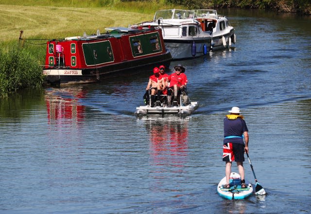 The team reclaimed the world record by completing the 128-mile course non-stop (Jonathan Brady/PA)