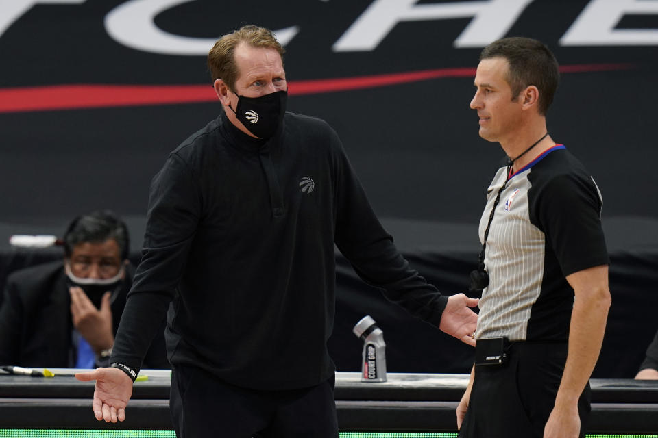Toronto Raptors head coach Nick Nurse argues with referee Kevin Scott (24) during the second half of an NBA basketball game against the Miami Heat Wednesday, Jan. 20, 2021, in Tampa, Fla. (AP Photo/Chris O'Meara)