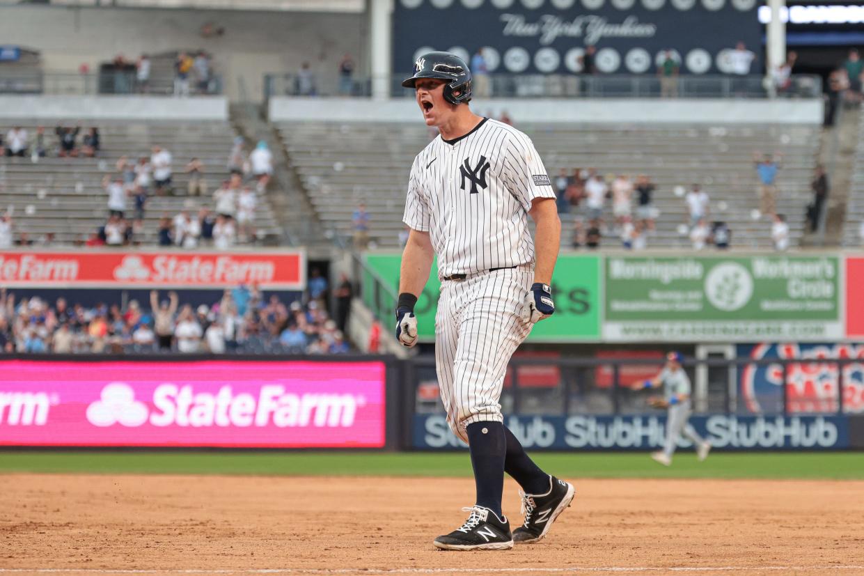 Aug 4, 2024; Bronx, New York, USA; New York Yankees third baseman DJ LeMahieu (26) celebrates after hitting a game-winning RBI singe during the tenth inning against the Toronto Blue Jays at Yankee Stadium.