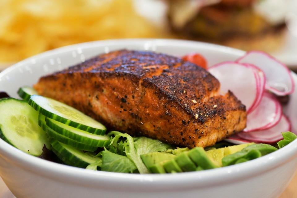 The Grilled Salmon Salad  is a signature menu offering at newly opened Southern Grounds located before the TSA secuirty checkpoint inside the Jacksonville International Airport. 