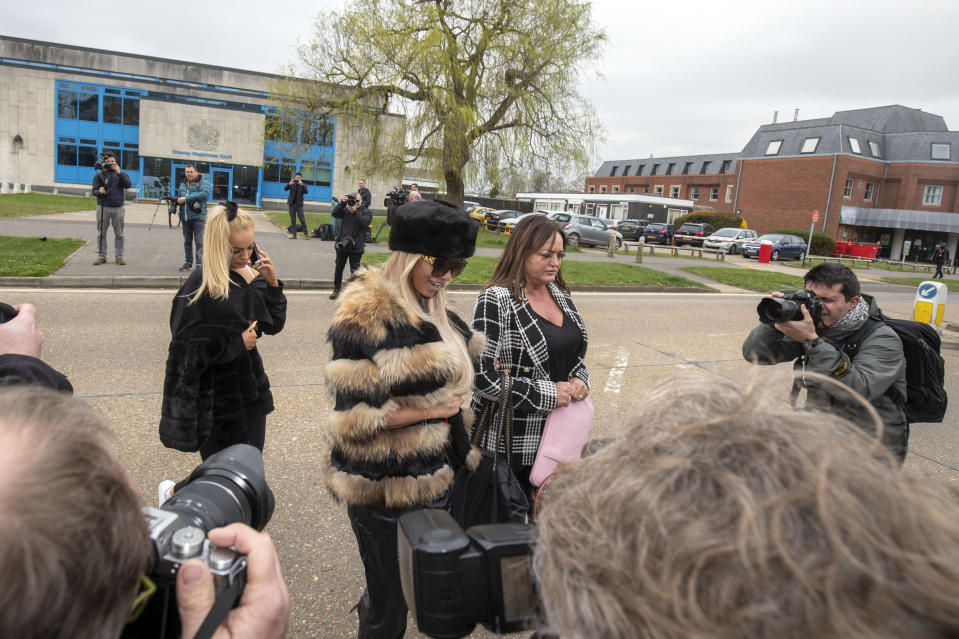 Katie Price (centre) leaves Crawley Magistrates' Court where she appeared on two counts of using threatening, abusive, words or behaviour to cause harassment, alarm or distress.