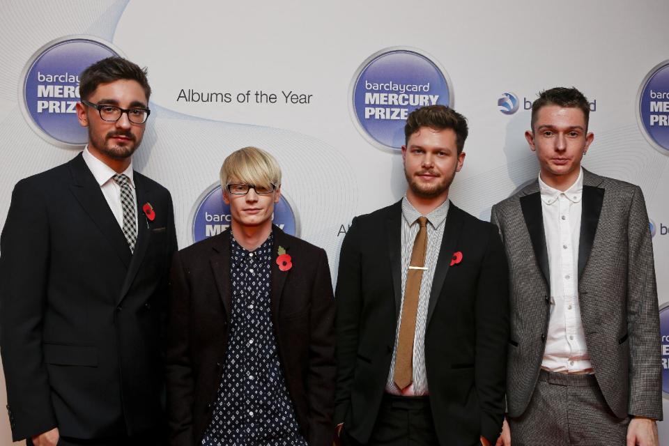 FILE - In this Nov. 1, 2012 file photo, from left, Gus Unger-Hamilton, Gwil Sainsbury, Joe Newman and Thom Green of Alt-J attend the Barclaycard Mercury Prize 2012 at the Roundhouse, in London. Their debut album, "An Awesome Wave," went on to win the prestigious Mercury Prize given to the top album of the year in the United Kingdom and Ireland. The Cambridge quartet has since been a near constant conversation piece on the blogosphere and mid-sized club circuit on both sides of the Atlantic Ocean. (AP Photo/Barclaycard Mercury Prize, Jon Furniss, File)