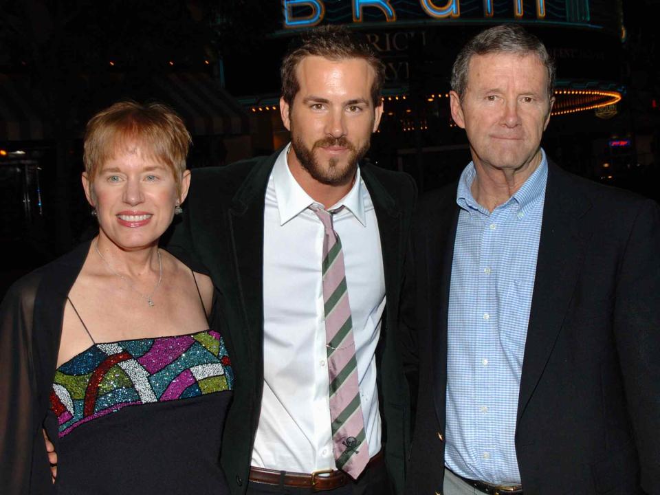 <p>E. Neitzel/WireImage</p> Ryan Reynolds with his parents, Tammy and James 