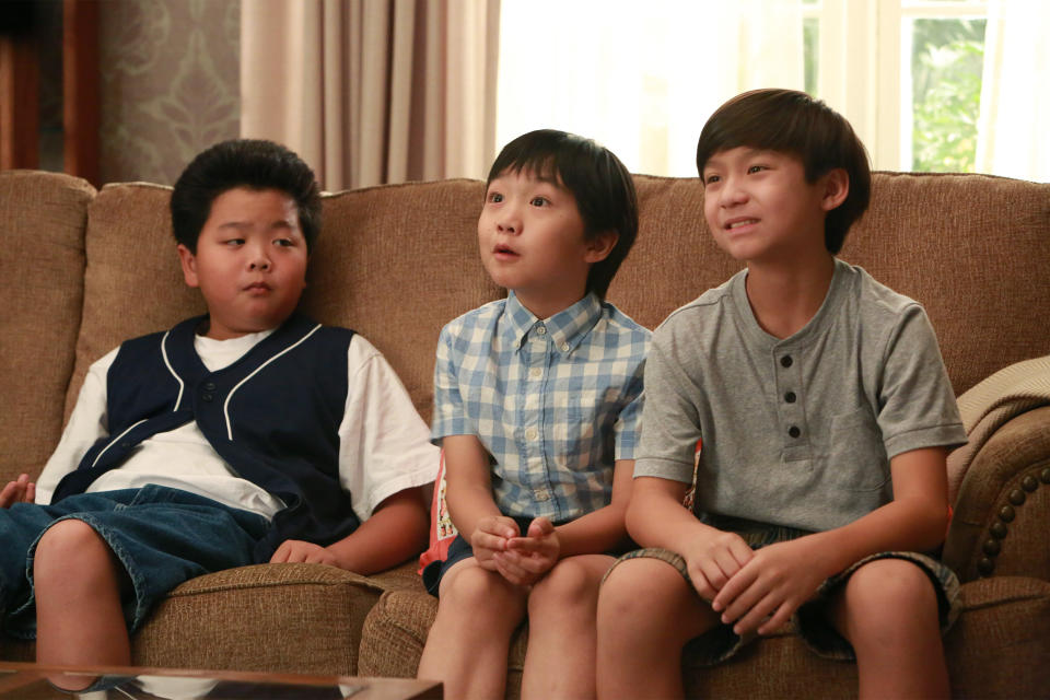 Hudson Yang, Ian Chen, and Forrest Wheeler seated on a couch, smiling and engaged in conversation