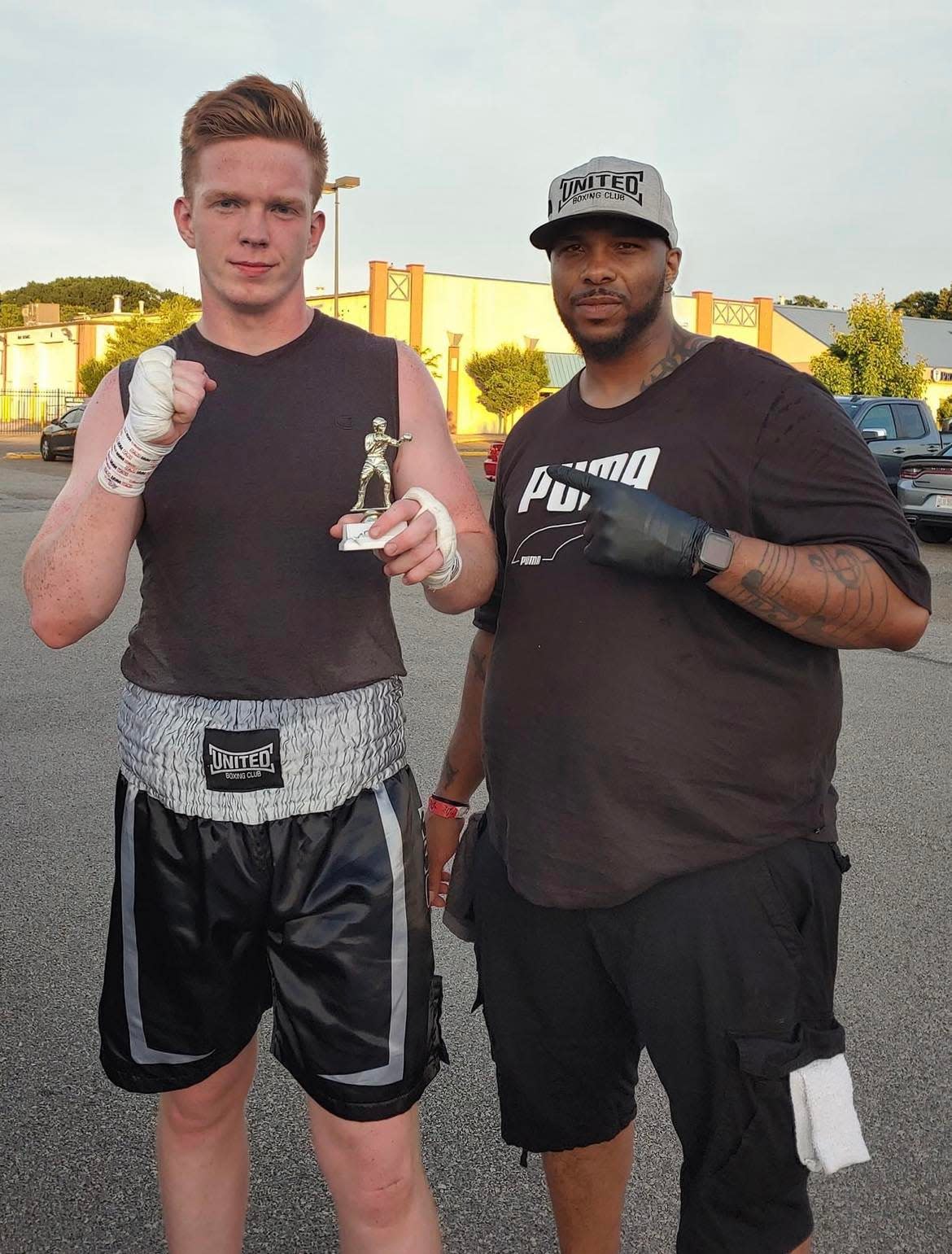 Nate Goodwin, 21, of Canton, left, is shown with Markees Watkins, owner of United Boxing Club in Canton. Goodwin is an amateur heavyweight boxer who will be fighting March 9 in The Brawl II at the Canton Memorial Civic Center.