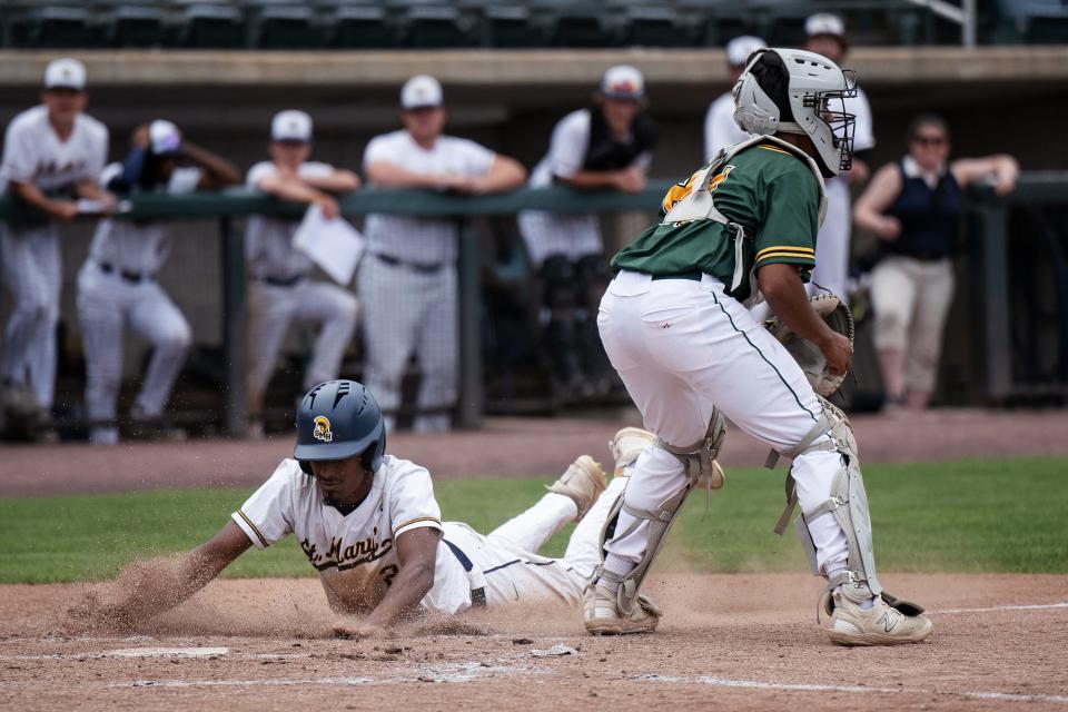 St. Mary's Gabe Diaz slides home ahead of the throw to Tantasqua catcher Brandon Phillips and scores the only run of the game.