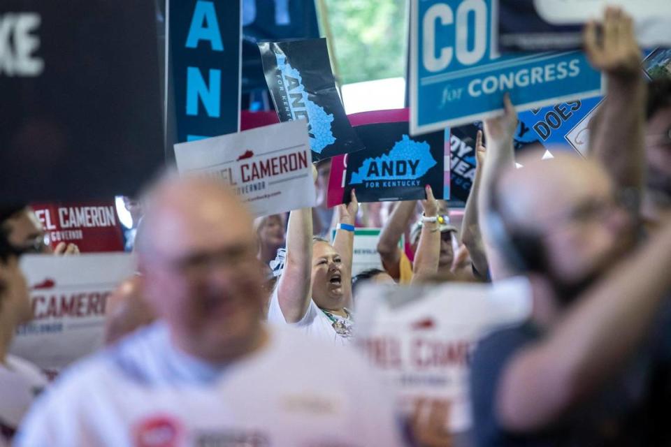 Kentucky Gov. Andy Beshear supporters hold signs and cheer during the annual St. Jerome Fancy Farm Picnic in Fancy Farm, Ky., on Saturday, Aug. 5, 2023.