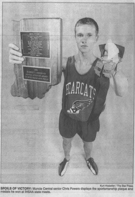 FILE -- Muncie Central senior Chris Powers displays the sportsmanship plaque and medals he won at IHSAA state meets.