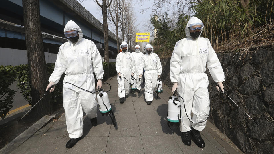 South Korean army soldiers spray disinfectant as a precaution against a new coronavirus on a street in Seoul, South Korea, Monday, March 9, 2020. (Ahn Young-joon/AP)