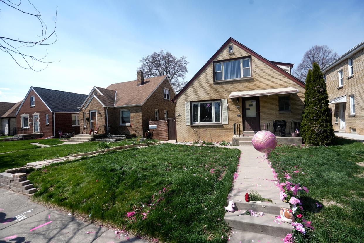 Friends and family of Sade Robinson, along with other community members, decorated the front yard of the home of her accused killer, Maxwell Anderson, in Milwaukee. Anderson was arrested April 4 and charged with first-degree intentional homicide, mutilating a corpse and arson relating to Robinson’s death. Pink was Sade’s favorite color.