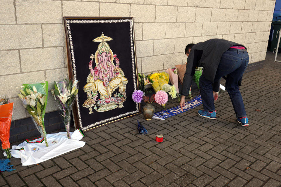 Flowers are seen outside Leicester City Football Club after a helicopter crashed in flames the day before, in Leicester, England, Sunday, Oct. 28, 2018. A helicopter belonging to Leicester City's owner — Thai billionaire Vichai Srivaddhanaprabha —crashed in flames in a carpark next to the soccer club's stadium shortly after it took off from the field following a Premier League game on Saturday night. (Aaron Chown/PA via AP)