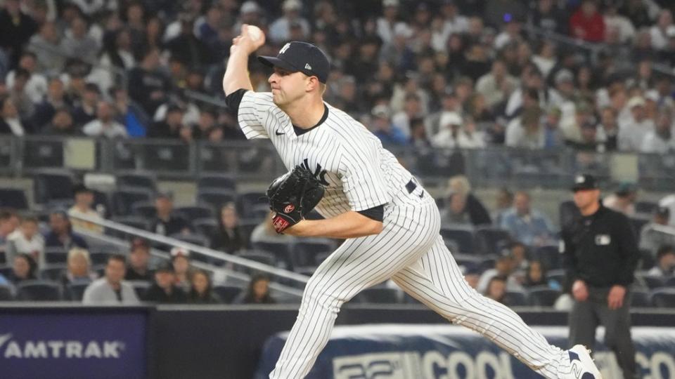 New York Yankees pitcher Michael King (34) delivers a pitch against the Baltimore Orioles during the tenth inning at Yankee Stadium.