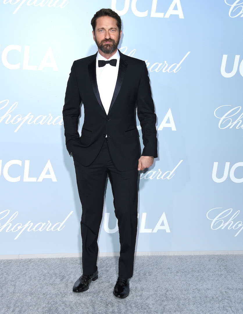 <p>Proving he scrubs up well, actor Gerard Butler looked dapper in a suit at the starry event. <em>[Photo: Getty]</em> </p>