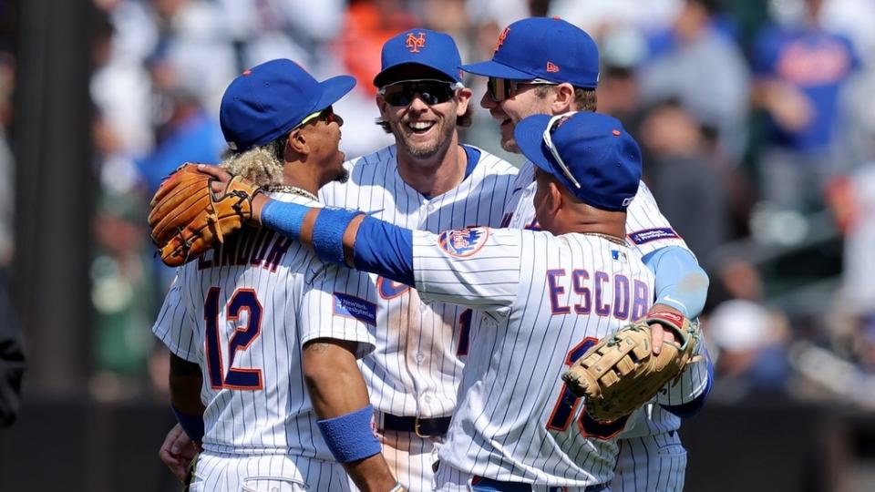May 18, 2023; New York City, New York, USA; New York Mets shortstop Francisco Lindor (12) and second baseman Jeff McNeil (1) and first baseman Pete Alonso (20) and third baseman Eduardo Escobar (10) celebrate after defeating the Tampa Bay Rays at Citi Field.