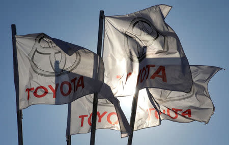 FILE PHOTO - Toyota flags wave at Motorcity Toyota dealership in Rome, Italy October 10, 2012. REUTERS/Max Rossi/File Photo