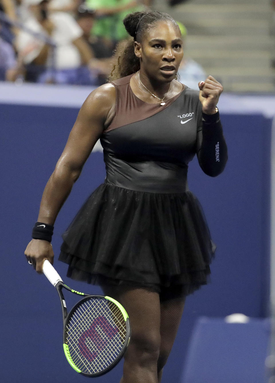 Serena Williams reacts after a point against Magda Linette, of Poland, during the first round of the U.S. Open tennis tournament, Monday, Aug. 27, 2018, in New York. (AP Photo/Julio Cortez)