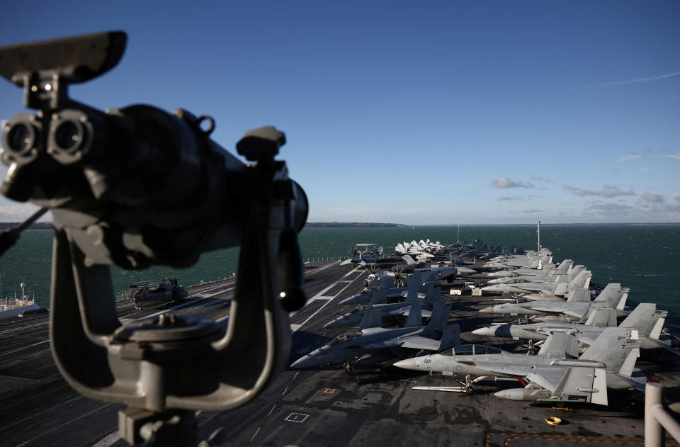 F-18 fighter jets are lined up on the flight deck of the U.S. Aircraft Carrier USS Gerald R. Ford while anchored in the Solent near Gosport, Britain, November 17, 2022. REUTERS/Henry Nicholls