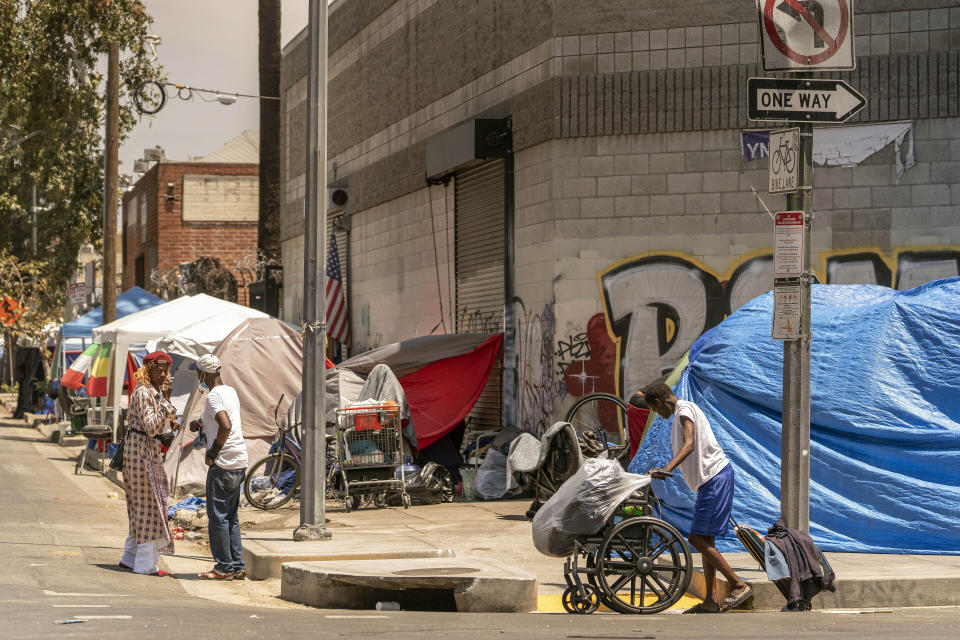 FILE - Tents line the streets of the Skid Row area of Los Angeles on July 22, 2022. Over the objections of homeless advocates, the Los Angeles City Council two years ago passed a broad anti-camping measure that was billed as a compassionate approach to get people off the streets and restore access to public spaces in the city with the nation's second-largest homeless population. (AP Photo/Damian Dovarganes, File)