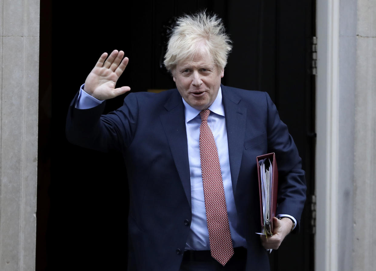 Britain's Prime Minister Boris Johnson leaves 10 Downing Street to attend the weekly session of Prime Ministers Questions in Parliament in London, Wednesday, Jan. 29, 2020. Britain officially leaves the European Union on Friday after a debilitating political period that has bitterly divided the nation since the 2016 Brexit referendum. (AP Photo/Kirsty Wigglesworth)