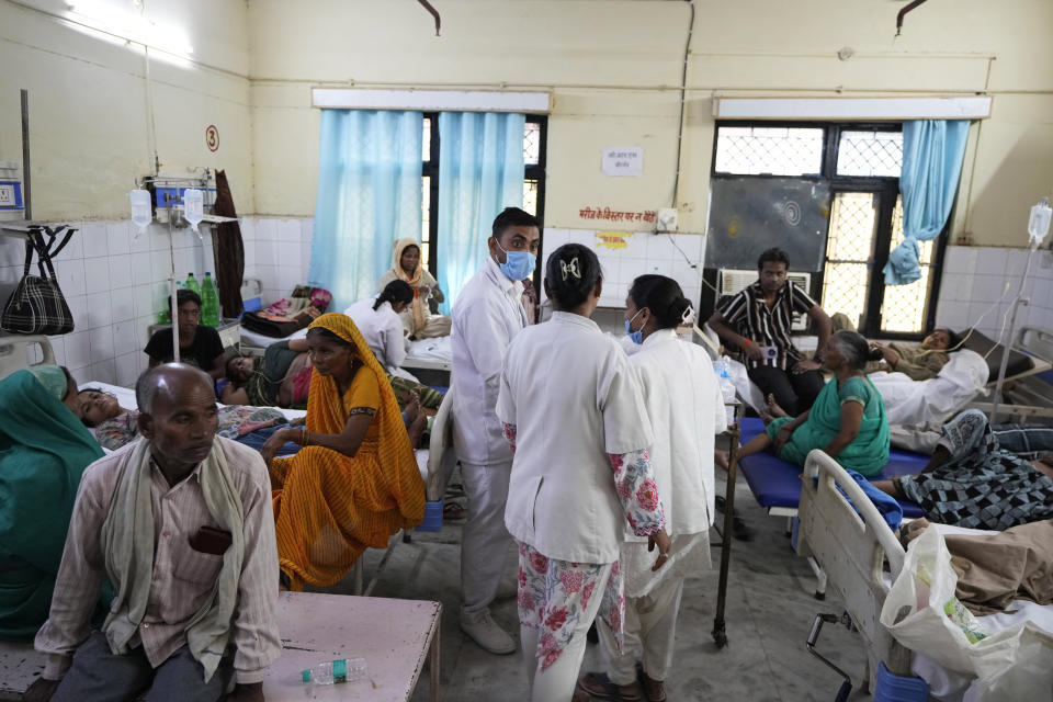 People injured in a stampede receive treatment at Hathras district hospital, Uttar Pradesh, India, Wednesday, July 3, 2024. Thousands of people at a religious gathering rushed to leave a makeshift tent, setting off a stampede Tuesday that killed more than hundred people and injured scores. (AP Photo/Rajesh Kumar Singh)