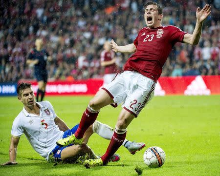 Denmark's Pierre-Emile Hojbjerg (R) is tackled by Matija Nastasic of Serbia during their Euro 2016 qualifying match in Copenhagen, Denmark, June 13, 2015. REUTERS/Bax Lindhardt/Scanpix Denmark