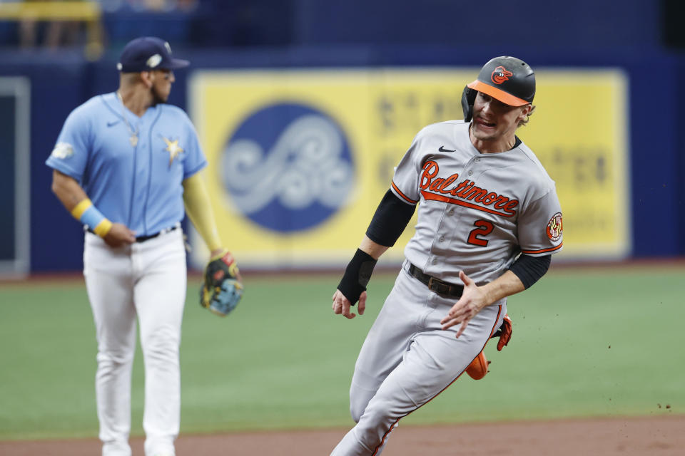 Baltimore Orioles' Gunnar Henderson rounds third base on his way to scoring against the Tampa Bay Rays during the first inning of a baseball game, Sunday, July 23, 2023, in St. Petersburg, Fla. (AP Photo/Scott Audette)