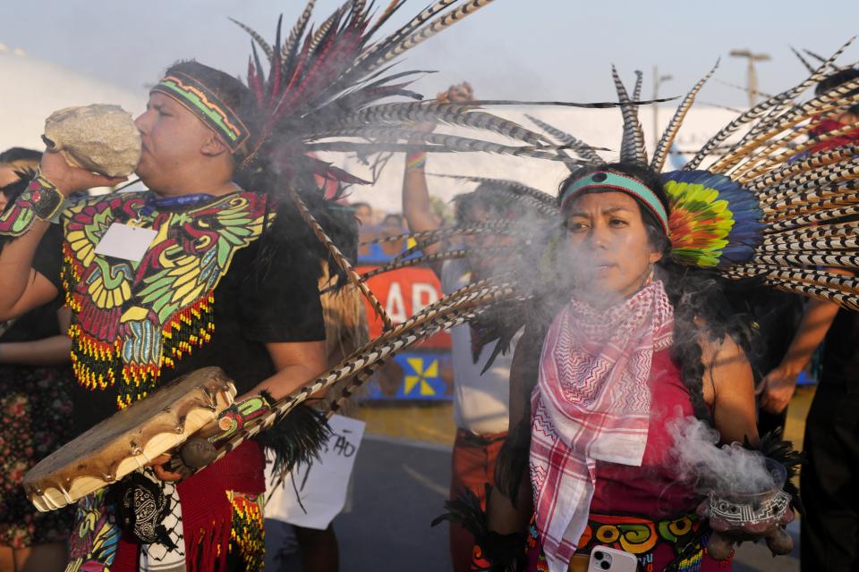 Activists demonstrate for climate justice at the COP28 U.N. Climate Summit, Saturday, Dec. 9, 2023, in Dubai, United Arab Emirates.(AP Photo/Rafiq Maqbool)