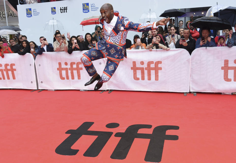 Rob Morgan jumps on the red carpet as he attends the premiere for "Just Mercy" on day two of the Toronto International Film Festival at the Roy Thomson Hall on Friday, Sept. 6, 2019, in Toronto. (Photo by Chris Pizzello/Invision/AP)