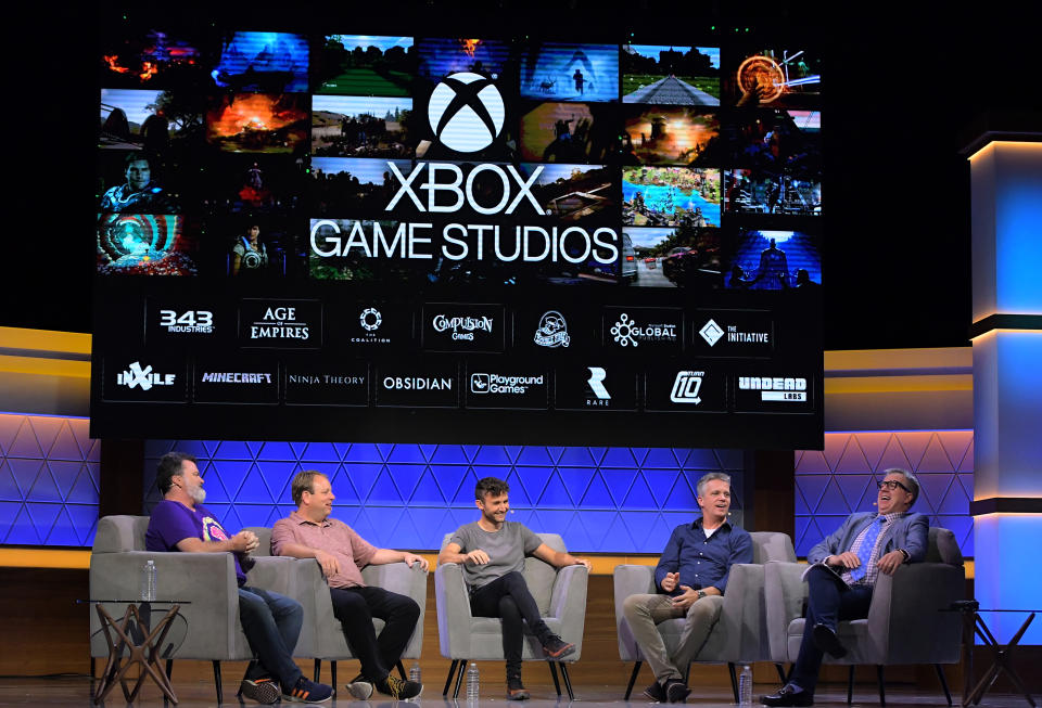 LOS ANGELES, CALIFORNIA - JUNE 12: (L-R) Tim Schafer, Feargus Urquhart, Dom Matthews, Matt Booty, Feargus Urquhart, and Larry Hryb speak onstage at the Xbox Game Studios - One Year Later panel during E3 2019 at the Novo Theatre on June 12, 2019 in Los Angeles, California. (Photo by Charley Gallay/Getty Images for E3/Entertainment Software Association)