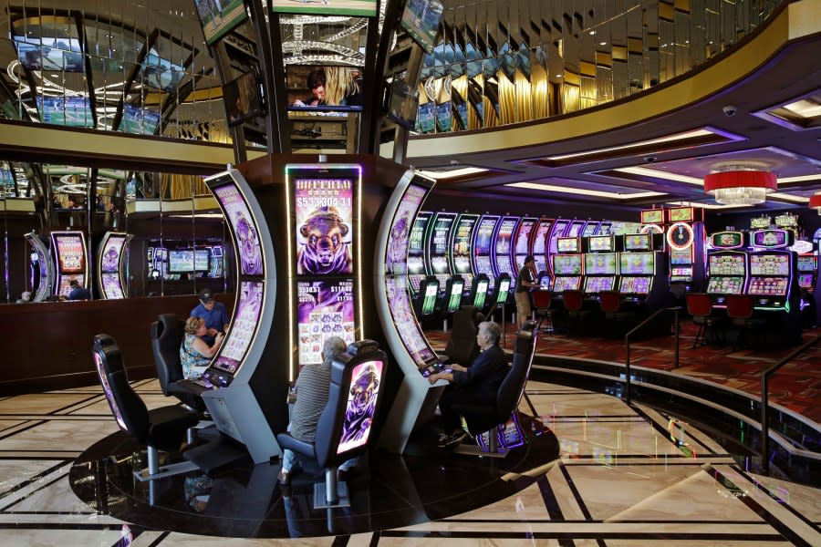 <em>People play slot machines in a newly opened expansion at the Golden Gate hotel-casino, Friday, Sept. 1, 2017, in Las Vegas. (AP Photo/John Locher)</em>