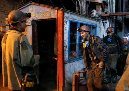 Miners exit an elevator after the end of their shift at the Novovolynska-9 coal mine in Novovolynsk, Ukraine August 2, 2018. Picture taken August 2, 2018. REUTERS/Valentyn Ogirenko