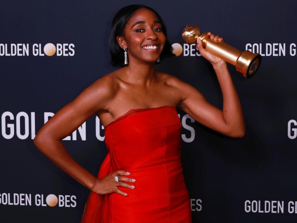 Ayo Edebiri holds her award at the 2024 Golden Globes.