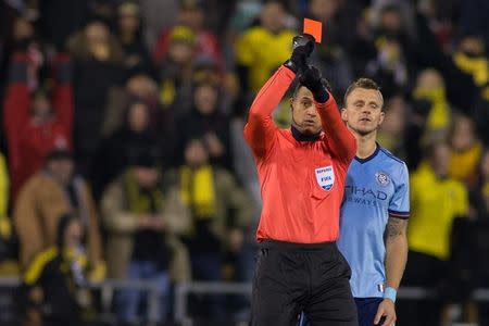 Oct 31, 2017; Columbus, OH, USA; Center referee Ismail Elfath goes to the VAR and issues a red card to New York City FC defender Alexander Callens (6) for a foul on Columbus Crew SC forward Justin Meram (not pictured) in the second half at MAPFRE Stadium. Mandatory Credit: Trevor Ruszkowski-USA TODAY Sports