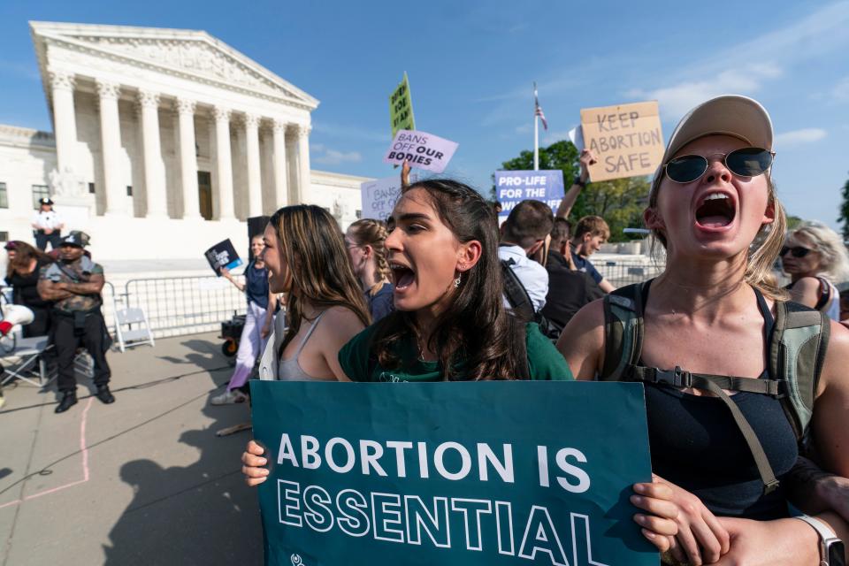 Demonstrators protest outside the U.S. Supreme Court on May 3, 2022.