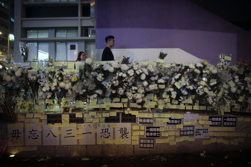 Flowers and notes are displayed as people pay their respects for protesters who were injured on Aug 31 outside Prince Edward station, in Hong Kong on Wednesday, Sept. 4, 2019. Hong Kong Chief Executive Carrie Lam has announced the government will formally withdraw an extradition bill that has sparked months of demonstrations in the city, bowing to one of the protesters' demands. The bill would have allowed Hong Kong residents to be sent to mainland China for trials. It sparked massive protests that have become increasingly violent and caused the airport to shut down earlier this month. (AP Photo/Jae C. Hong)