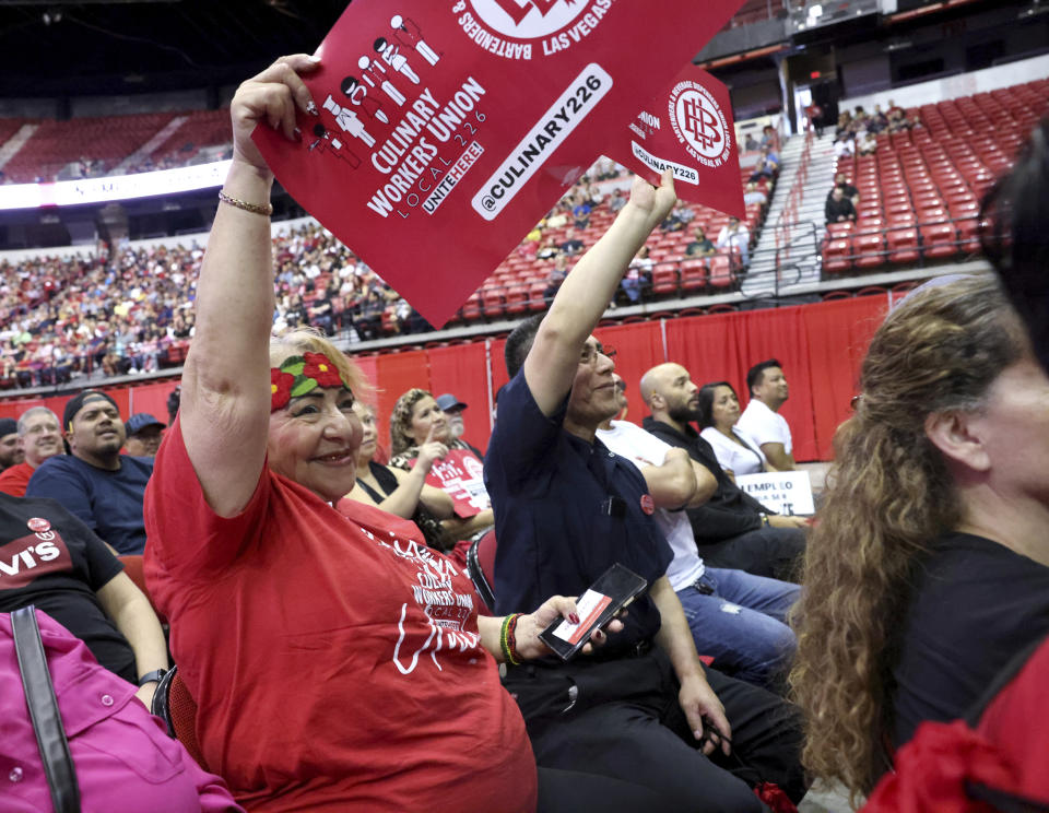 Culinary Union members, including Dulce Hernandez, left, who has worked at Caesars Palace for 20 years, and German Hernandez, who works at Luxor, rally ahead of a strike vote, Tuesday, Sept. 26, 2023, at Thomas & Mack Center on the UNLV campus in Las Vegas. Tens of thousands of hospitality workers who keep the iconic casinos and hotels of Las Vegas humming were set to vote Tuesday on whether to authorize a strike amid ongoing contract negotiations. (K.M. Cannon/Las Vegas Review-Journal via AP)