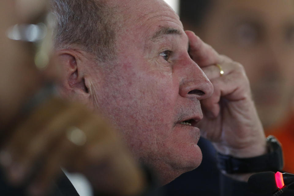 Brazil's Defense Minister Fernando Azevedo listens to a question during a press conference on the Defense Committee's action in response to the ongoing oil spill on beaches in the northeast region, in Brasilia, Brazil, Tuesday, Oct. 29, 2019. Since the start of September, a mysterious oil spill has sullied almost 250 beaches on Brazil's northeastern coast. According to the Navy, which is overseeing an investigation, its primary hypothesis is that the oil it spilled from a boat navigating off Brazil's shore. (AP Photo/Eraldo Peres)